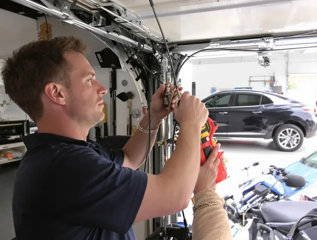 Enfield Garage Door Repair safety certified technician performing cable replacement in Enfield