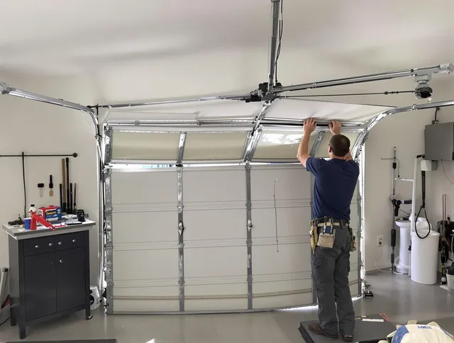 Enfield Garage Door Repair specialist performing precise section replacement on Enfield garage door